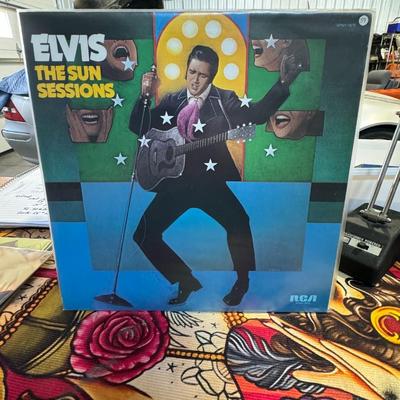 Sale Photo Thumbnail #139: Elvis The Sun Sessions, released by RCA Records in 1976. 
Here is information about this album:
Content: This compilation includes Elvis Presley's earliest commercial recordings. These were made at Sun Records in Memphis, Tennessee, in 1954 and 1955, unde