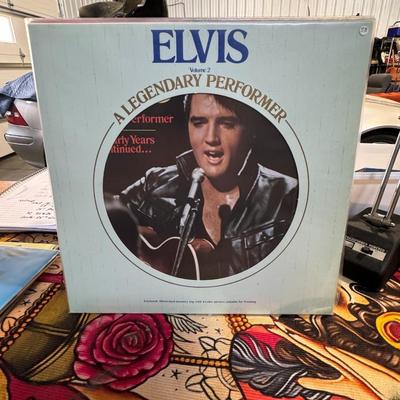 Sale Photo Thumbnail #99: Elvis: A Legendary Performer Volume 2 by Elvis Presley. 
Here are some details about this album:
Format: It is a vinyl LP (Long Play) record, and this particular image shows the album cover.
Release: Released in 1976 by RCA Records, this is the second vol
