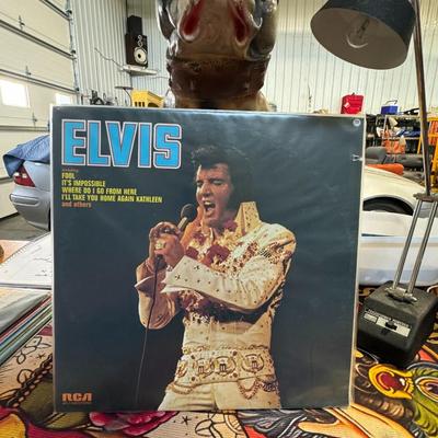 Sale Photo Thumbnail #68: "Elvis" by Elvis Presley. It was released on the RCA Victor label with the catalog number APL1-0283. The album is also known as the "Fool Album" due to its lead track, "Fool". 
Key details:
Release Year: 1973.
Record Label: RCA Victor.
Format: 12" Vinyl L