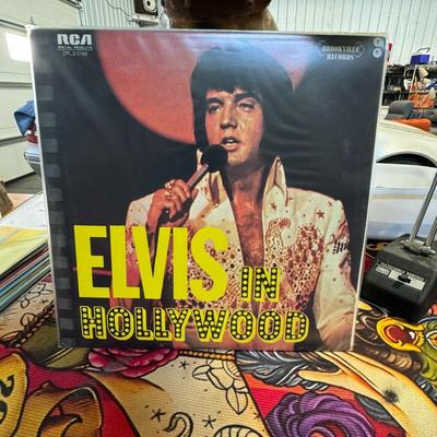 Sale Photo Thumbnail #66: Elvis in Hollywood double LP vinyl record album by Elvis Presley. 
Here's some information about this album:
Artist: Elvis Presley.
Title: Elvis in Hollywood.
Release Year: It was originally issued in January 1976.
Record Labels: RCA Special Products and 