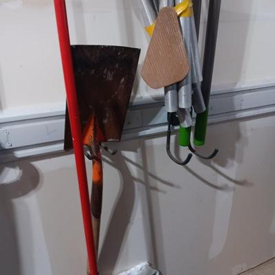 LARGE WIND CHIME, PUSH BROOM, SNOW SHOVEL, POST HOLE DIGGER, SHOVEL AND SOME ICE MELT