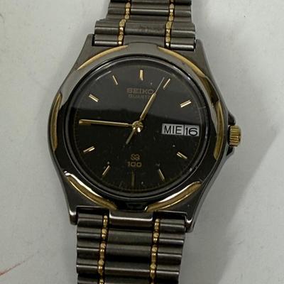 Vintage Seiko Men's Quartz QS 100 Watch 8123-6349 Black Steel Gold Date 10 Bar