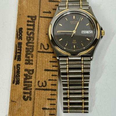 Vintage Seiko Men's Quartz QS 100 Watch 8123-6349 Black Steel Gold Date 10 Bar