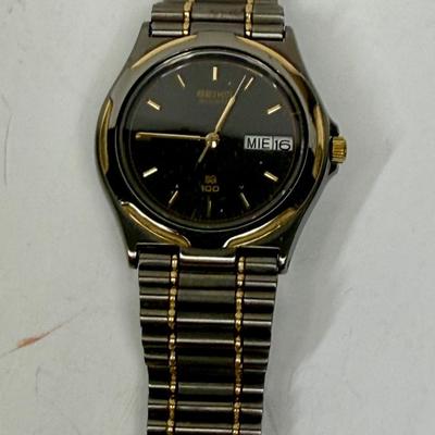 Vintage Seiko Men's Quartz QS 100 Watch 8123-6349 Black Steel Gold Date 10 Bar