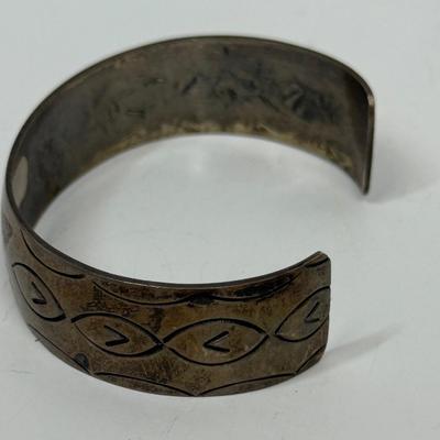 Sale Photo Thumbnail #500: Bracelet has markings inside that are faint and could not be identified, but the bracelet has the look and feel of a vintage silver bracelet.