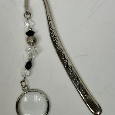 Purse Keeper with attached magnifying glass