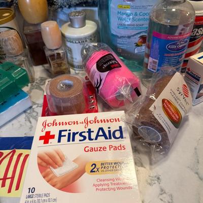 Sale Photo Thumbnail #458: Bandaids, mouth wash, pill container, etc.