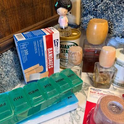 Sale Photo Thumbnail #457: Bandaids, mouth wash, pill container, etc.
