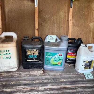 Sale Photo Thumbnail #528: Lubricant and hydraulic fluid jugs