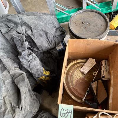 Sale Photo Thumbnail #558: John Deere cover (not sure exactly for what), carpet adhesive, etc.