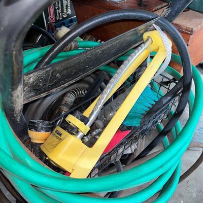 Sale Photo Thumbnail #707: Several hoses, hose reel cart on wheels, sprinkler, etc.