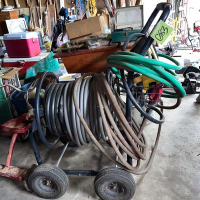Sale Photo Thumbnail #706: Several hoses, hose reel cart on wheels, sprinkler, etc.
