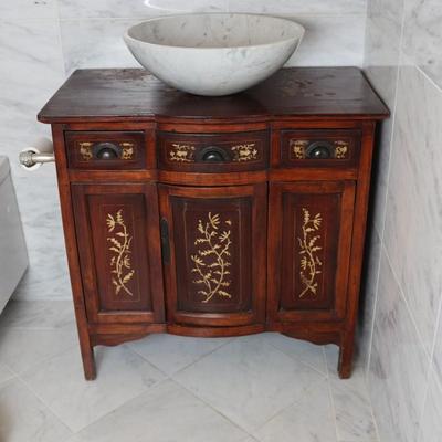 Wood Cabinet Vanity with Marble Vessel Sink and Gold Floral Detail