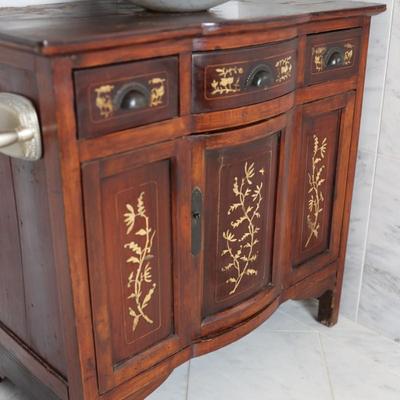 Wood Cabinet Vanity with Marble Vessel Sink and Gold Floral Detail