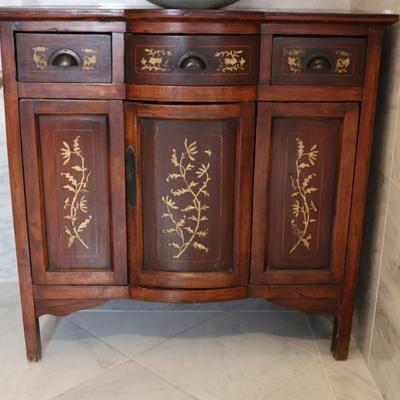 Wood Cabinet Vanity with Marble Vessel Sink and Gold Floral Detail