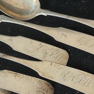 Sale Photo Thumbnail #568: These are stamped T K Emory, and engraved with initials on the front.  
Research says they are coin silver, 900 purity.  Set of 8 
Retail is $15 to $30 per spoon