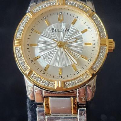 Sale Photo Thumbnail #575: Ladies Bulova Gold Silver tone 24 diamond accented watch.
Retails up to $285.00
New battery