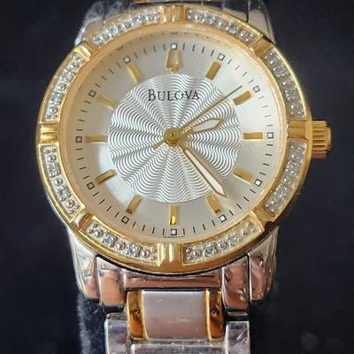 Sale Photo Thumbnail #574: Ladies Bulova Gold Silver tone 24 diamond accented watch.
Retails up to $285.00
New battery