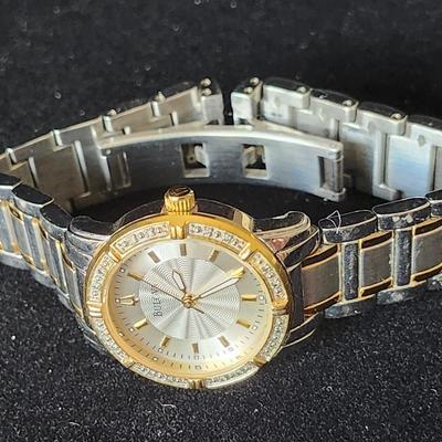 Sale Photo Thumbnail #577: Ladies Bulova Gold Silver tone 24 diamond accented watch.
Retails up to $285.00
New battery