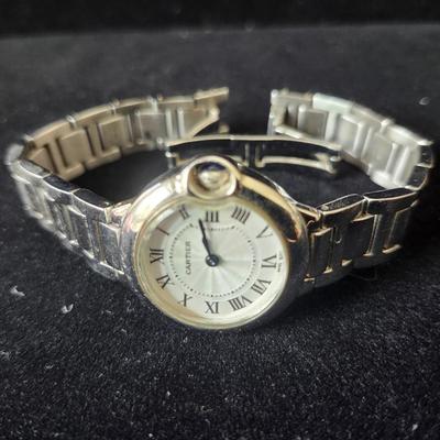 Sale Photo Thumbnail #588: SS case, quartz movement, water resistant, Swiss, 
Blue sapphire cabochon crown, fair condition.
Age related wear (could be buffed out by a jeweler)
Untested, may require winding, parts, service or repair.
We did not do any work on this watch due to the v
