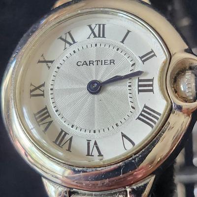 Sale Photo Thumbnail #585: SS case, quartz movement, water resistant, Swiss, 
Blue sapphire cabochon crown, fair condition.
Age related wear (could be buffed out by a jeweler)
Untested, may require winding, parts, service or repair.
We did not do any work on this watch due to the v