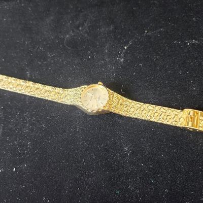 Sale Photo Thumbnail #593: We do not know if this is the brand name watch, it is being sold as is.
It will need a battery.