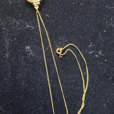 Sale Photo Thumbnail #614: Nuggets in a gold tone case, the karat content of the nuggets is unknown.
The 17 inch chain is 10K gold.