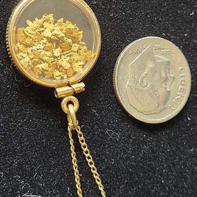 Sale Photo Thumbnail #616: Nuggets in a gold tone case, the karat content of the nuggets is unknown.
The 17 inch chain is 10K gold.