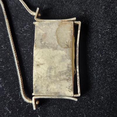 Sale Photo Thumbnail #620: Artisan Ann Grundler original art necklace, moslach glass set in sterling.  1.5 inches x 2 inches. 
9 inch drop.  
Retail $300+