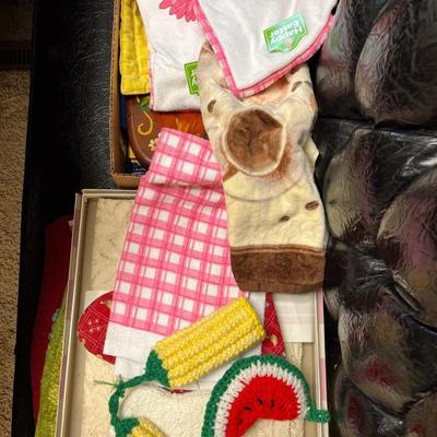 Sale Photo Thumbnail #1170: Potholders, bowl, placemats, tablecloth, etc.