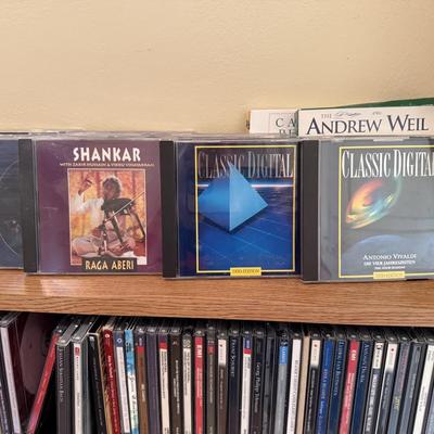 Very large collection of CDs, includes cd shelf
