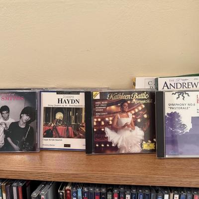 Very large collection of CDs, includes cd shelf