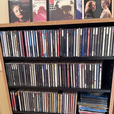 Very large collection of CDs, includes cd shelf