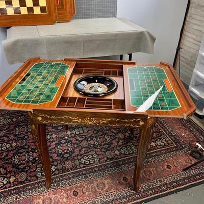 Sale Photo Thumbnail #3: Table is in excellent condition, 30" square and 30" tall. Beautifully kept circa 1960's inlay table. Chess, Checkers, Backgammon, Felt top for cards, including a roulette table. If shipping is desired we can facilitate dropping of at a crater/shipping com