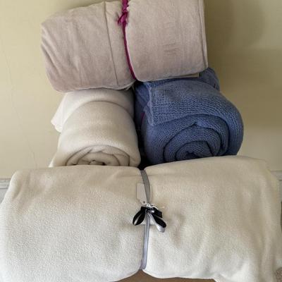 Four soft fleece throws