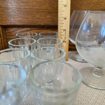 Brandy Snifter glasses 5, glass egg cups 8.