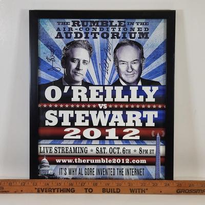 LOT 87: Autographed Framed "The Rumble in the Air-Conditioned Auditorium" Poster Autographed by Jon Stewart and Bill O'Reilly