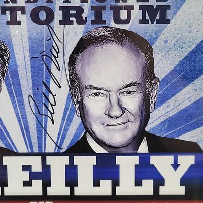 LOT 87: Autographed Framed "The Rumble in the Air-Conditioned Auditorium" Poster Autographed by Jon Stewart and Bill O'Reilly