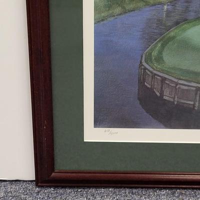 LOT 100: Framed Artwork of The 16th Hole of The Players Stadium Course at TPC Sawgrass in Ponte Vedra, Florida.