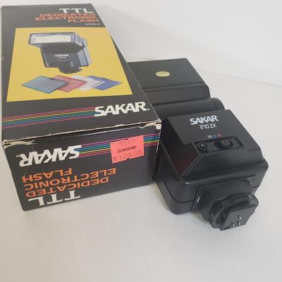 LOT 104: Vintage 110 Film Camera, Flash, Camcorder Light, Digital Camera Charger