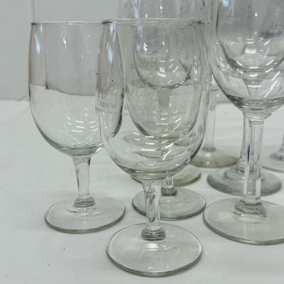 LOT 182: Large Lot of Glassware: Branded Stemware, Martini Glasses & More