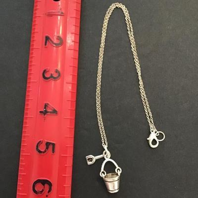 Vintage Silvertone necklace with sand, bucket and shovel pendant