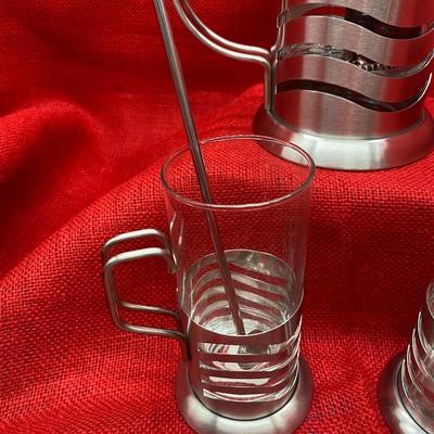 Sale Photo Thumbnail #638: NEW in box, with 2 spoons
Wave pattern
Glasses are 5.5 inches tall, coffee press is 9 inches tall
