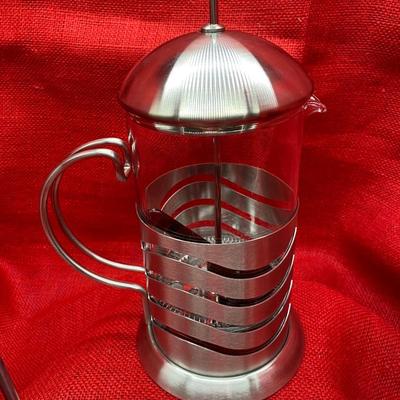 Sale Photo Thumbnail #639: NEW in box, with 2 spoons
Wave pattern
Glasses are 5.5 inches tall, coffee press is 9 inches tall