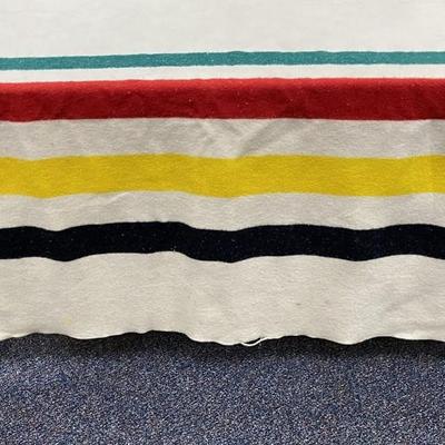 Sale Photo Thumbnail #642: Stripes historically indicated value of blanket.
Colors reflect distinguishing characteristics of the park
Slight tear on the edge binding, easily repaired
66 inches x 90 inches 
There are a few stains, dry cleaning will give you a beautiful blanket