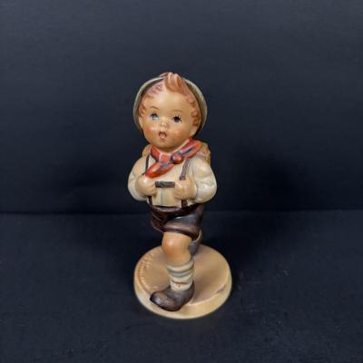 LOT 99: Set of 2 Hummels: Blessed Event & School Boy along with a Napco The Singer Figure