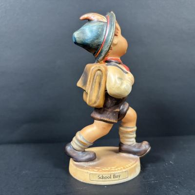 LOT 99: Set of 2 Hummels: Blessed Event & School Boy along with a Napco The Singer Figure
