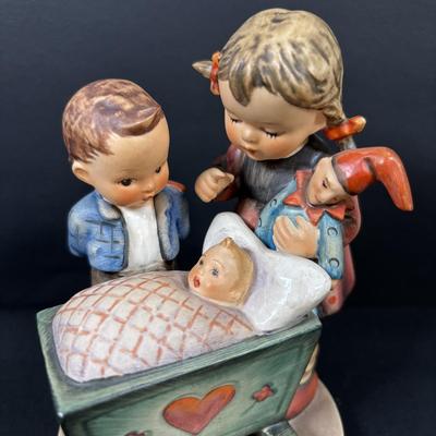 LOT 99: Set of 2 Hummels: Blessed Event & School Boy along with a Napco The Singer Figure