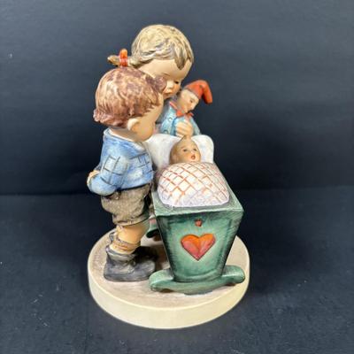 LOT 99: Set of 2 Hummels: Blessed Event & School Boy along with a Napco The Singer Figure