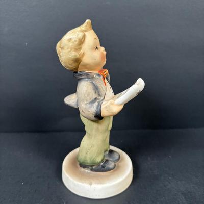 LOT 99: Set of 2 Hummels: Blessed Event & School Boy along with a Napco The Singer Figure